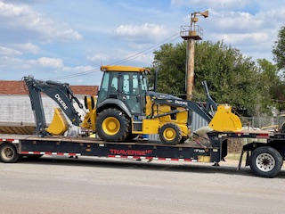 backhoe on trailer